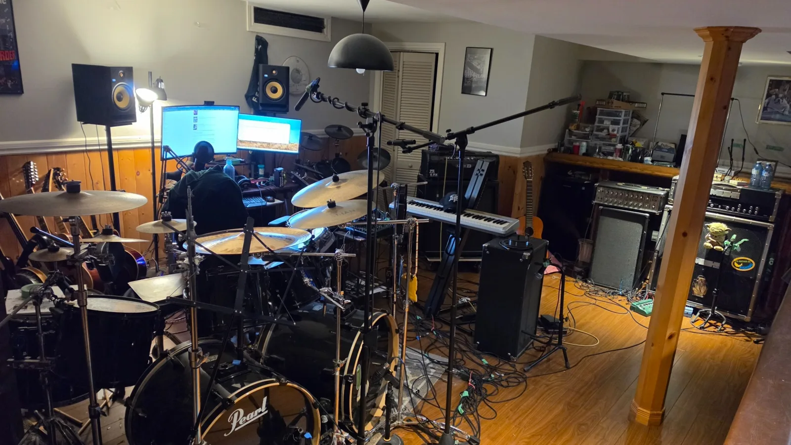 Wide view of Foundation Studios with drums and microphones